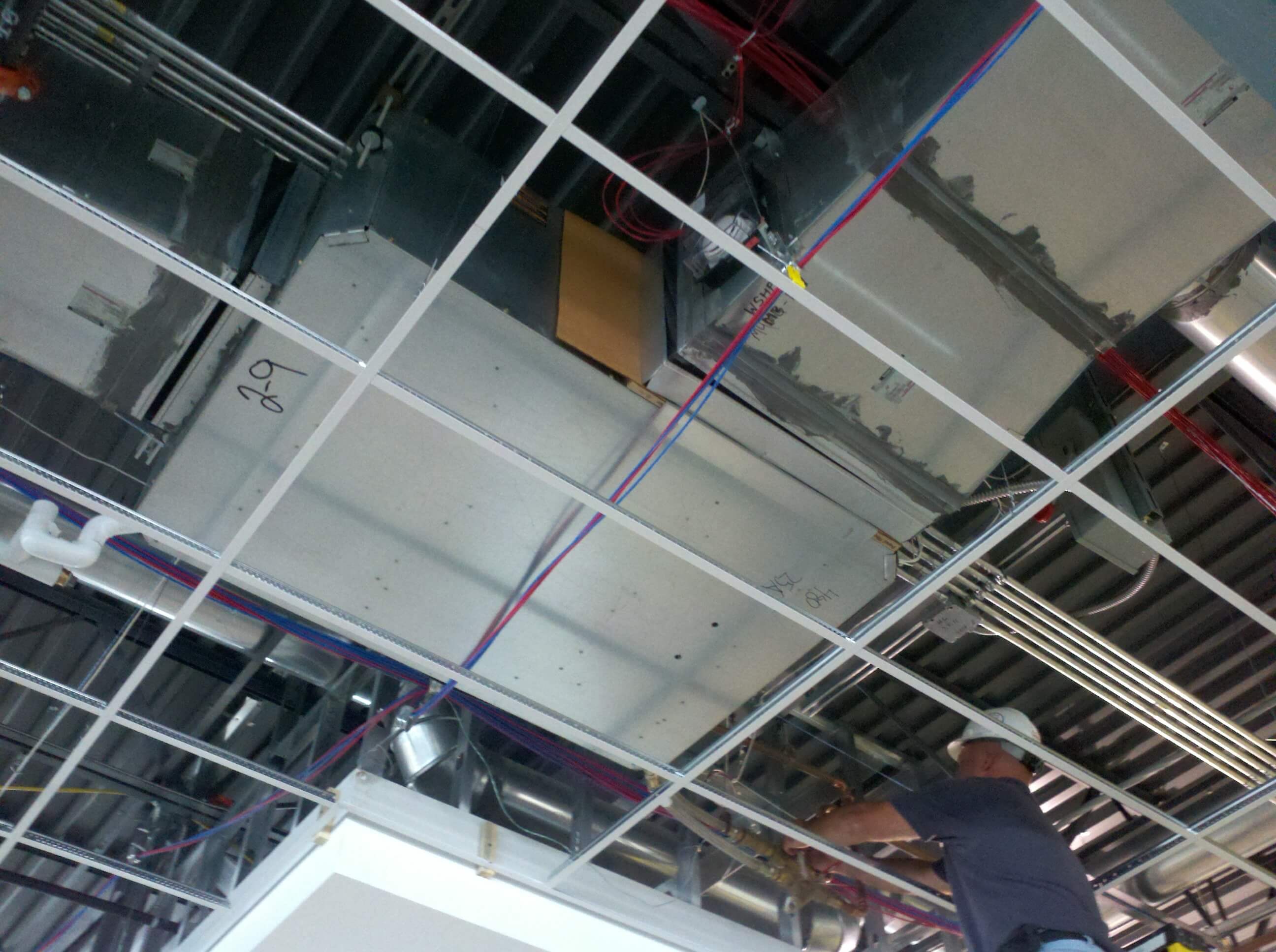 Geauga Mechanical Employee Installing an HVAC System